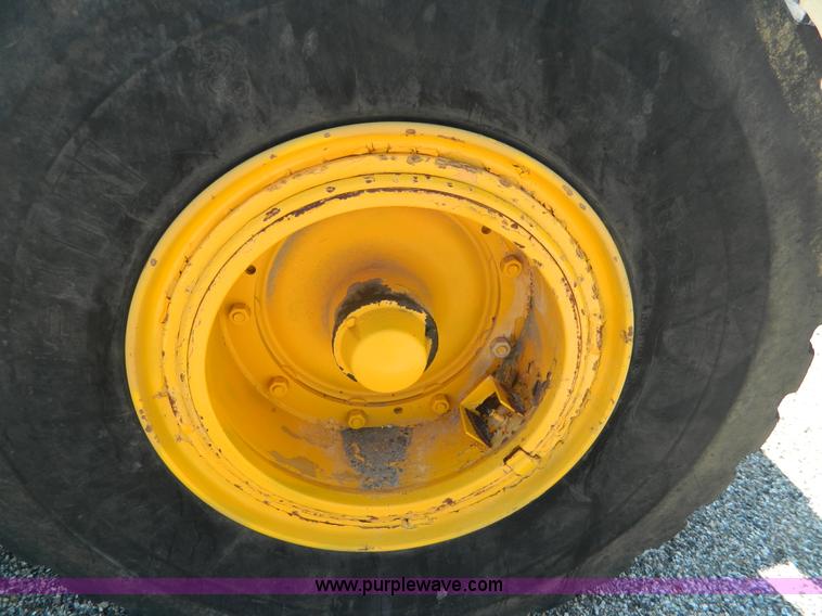 image for item AD9220 John Deere 760A paddle scraper