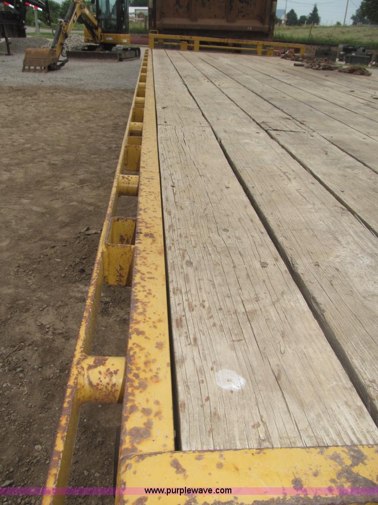 image for item F7028 2003 PJ 28'L deck over tandem axle tag trailer