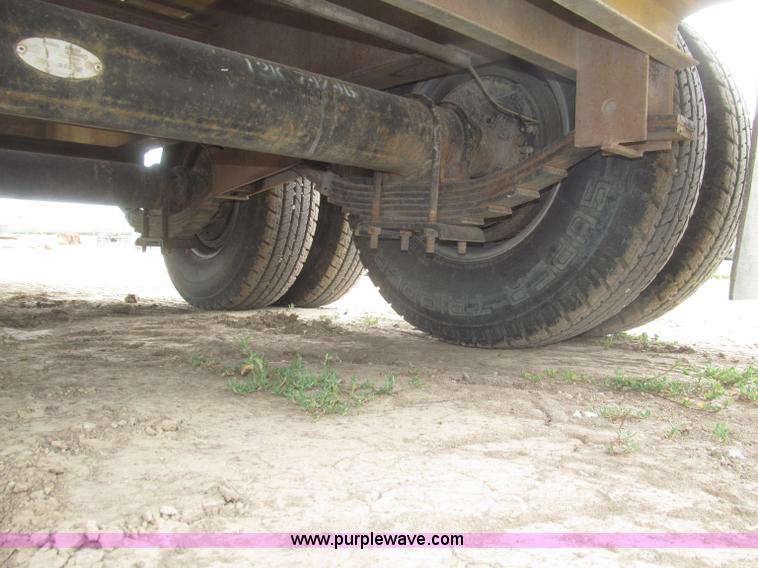 image for item F7028 2003 PJ 28'L deck over tandem axle tag trailer