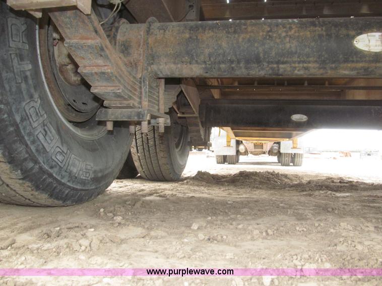 image for item F7028 2003 PJ 28'L deck over tandem axle tag trailer