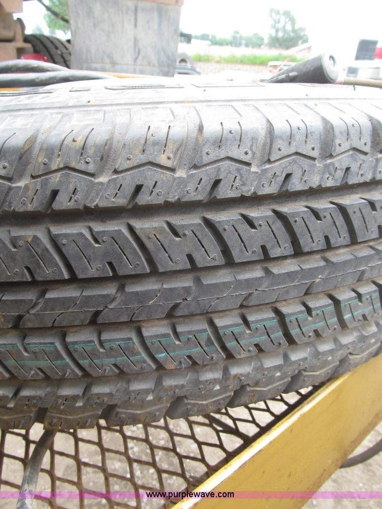 image for item F7028 2003 PJ 28'L deck over tandem axle tag trailer