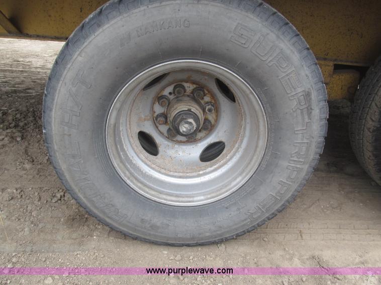 image for item F7028 2003 PJ 28'L deck over tandem axle tag trailer