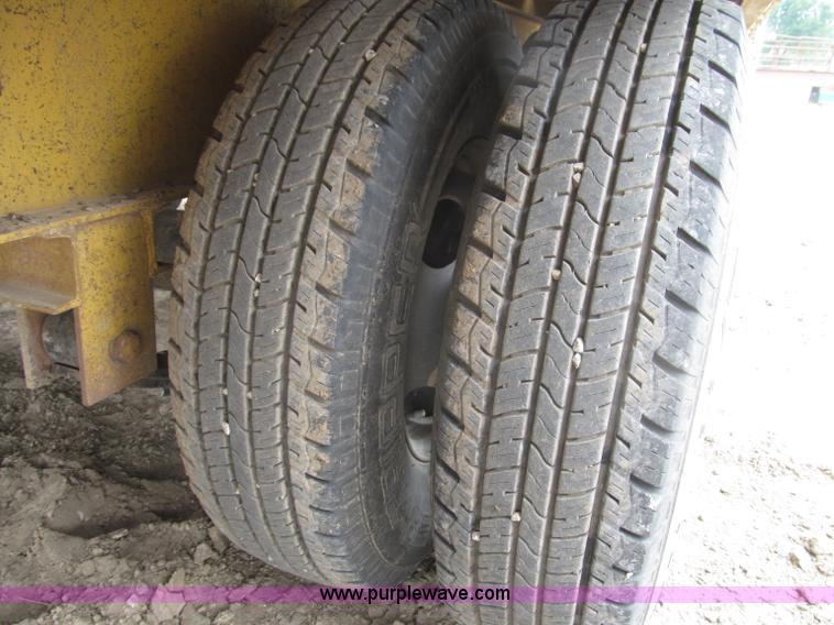 image for item F7028 2003 PJ 28'L deck over tandem axle tag trailer