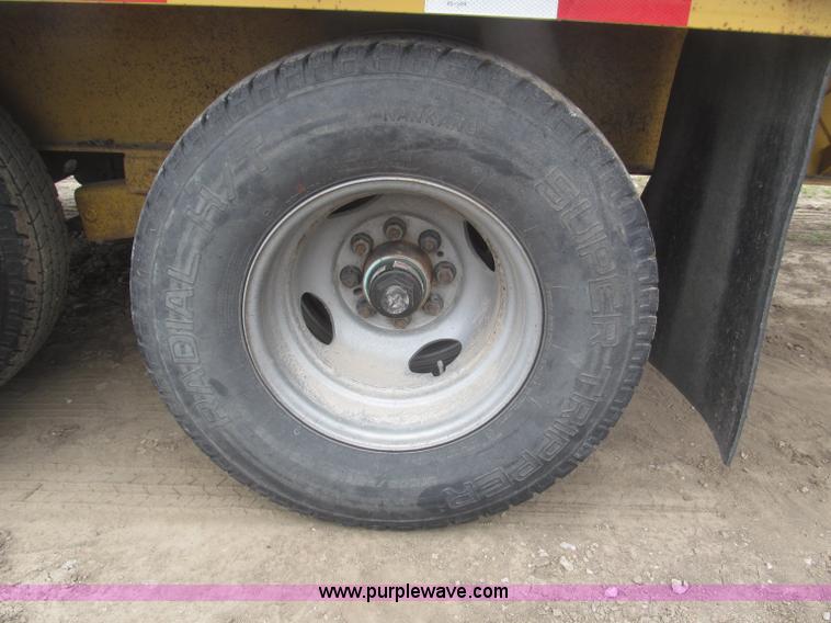 image for item F7028 2003 PJ 28'L deck over tandem axle tag trailer