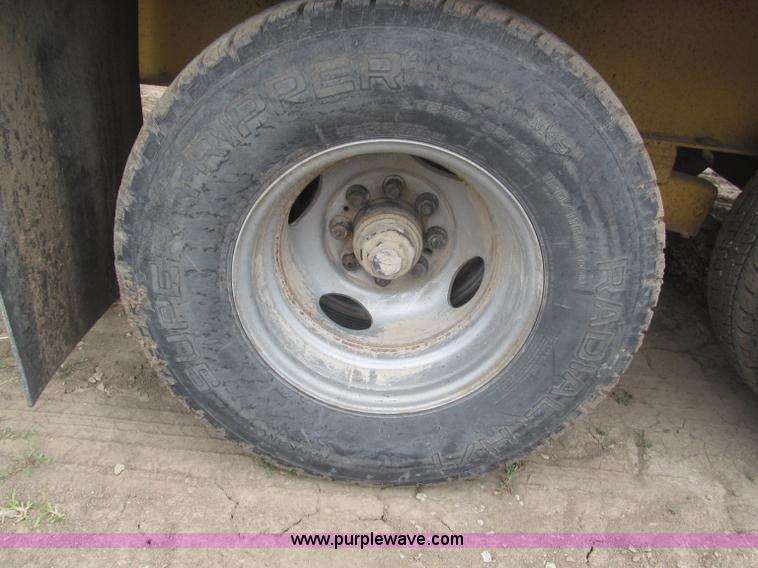 image for item F7028 2003 PJ 28'L deck over tandem axle tag trailer