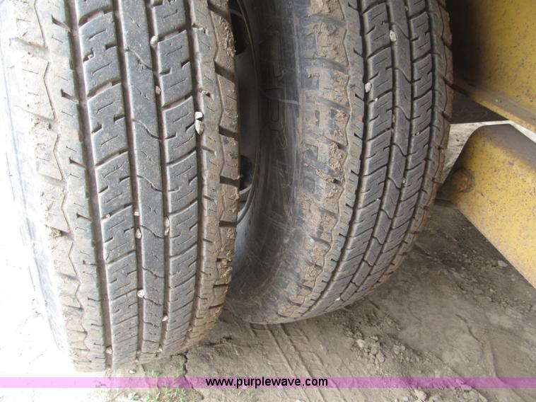 image for item F7028 2003 PJ 28'L deck over tandem axle tag trailer