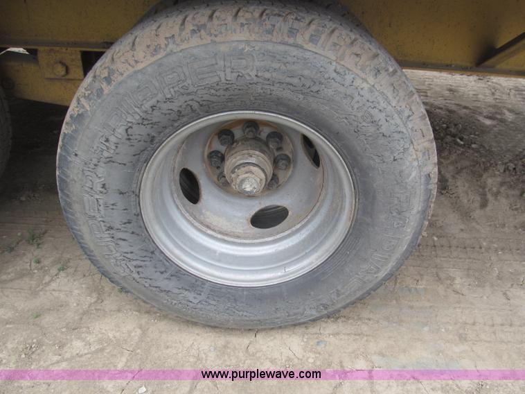 image for item F7028 2003 PJ 28'L deck over tandem axle tag trailer