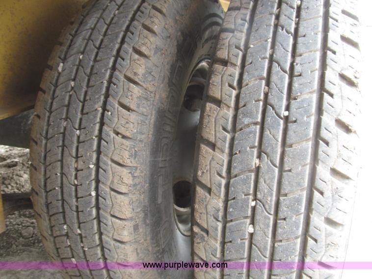 image for item F7028 2003 PJ 28'L deck over tandem axle tag trailer