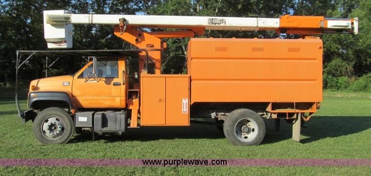 image for item G2038 1999 GMC C7500 bucket/tree trimming truck
