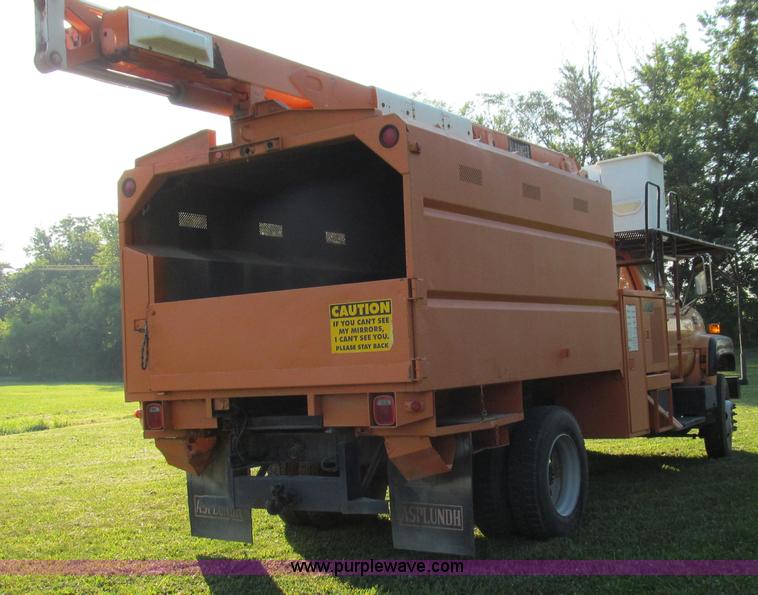 image for item G2038 1999 GMC C7500 bucket/tree trimming truck