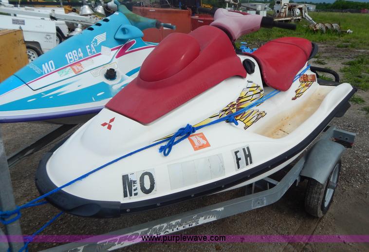 image for item AE9861 Two personal watercrafts and trailer