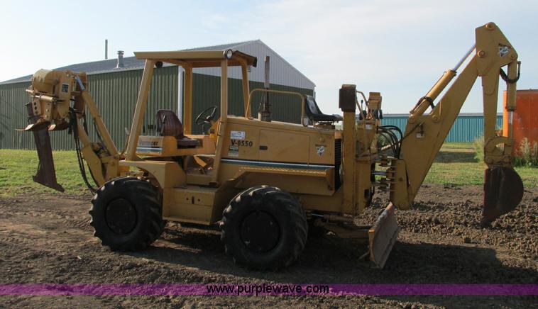 image for item E5184 1995 Vermeer V8550 vibratory plow backhoe