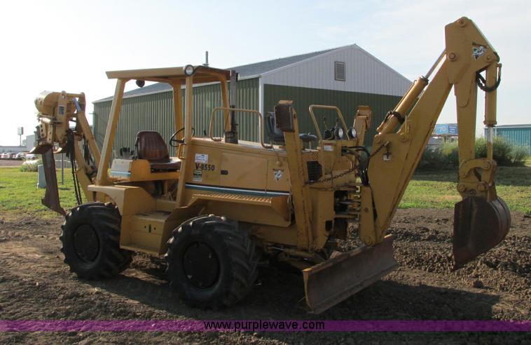 image for item E5184 1995 Vermeer V8550 vibratory plow backhoe