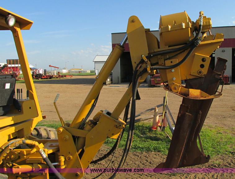 image for item E5184 1995 Vermeer V8550 vibratory plow backhoe