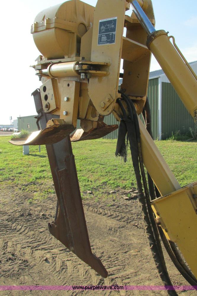 image for item E5184 1995 Vermeer V8550 vibratory plow backhoe