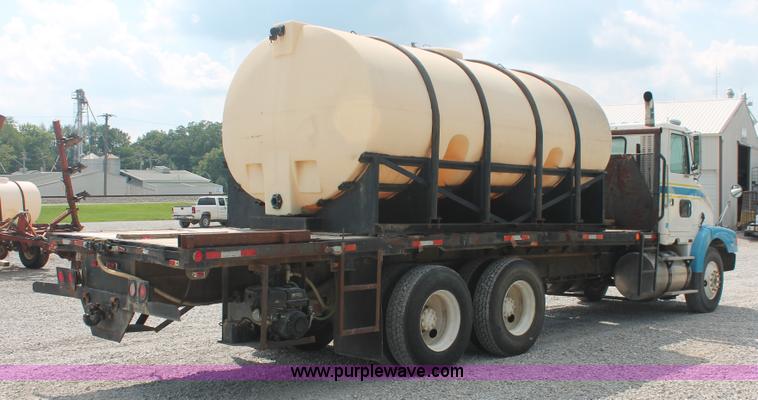 image for item I7876 1994 Volvo WG flatbed liquid nurse truck