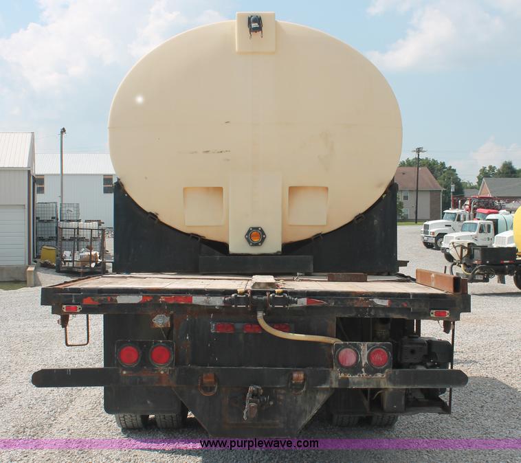 image for item I7876 1994 Volvo WG flatbed liquid nurse truck