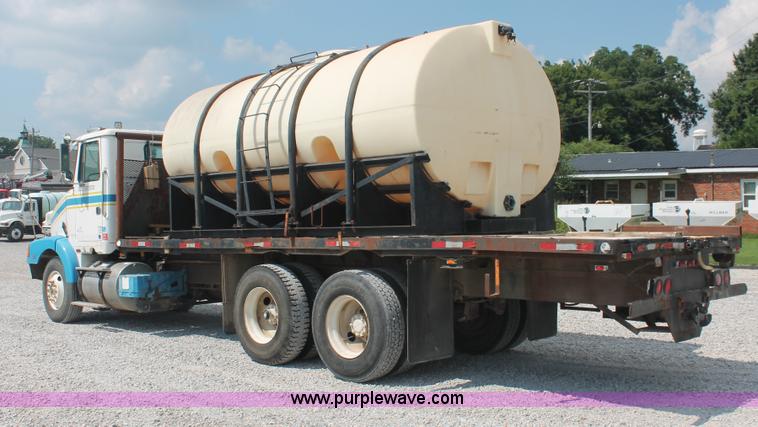 image for item I7876 1994 Volvo WG flatbed liquid nurse truck