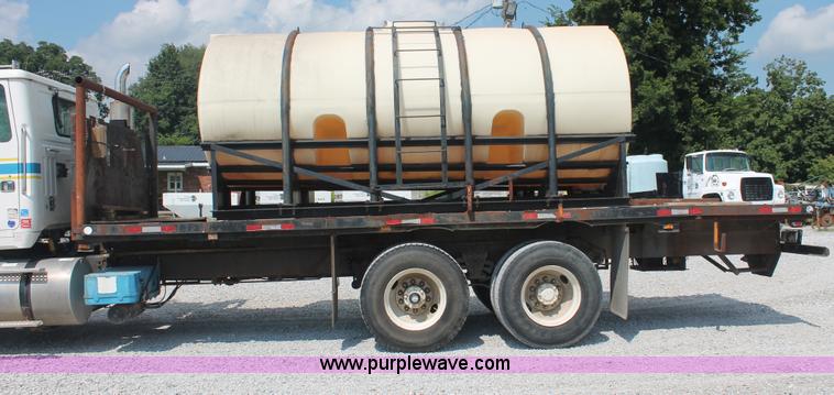 image for item I7876 1994 Volvo WG flatbed liquid nurse truck