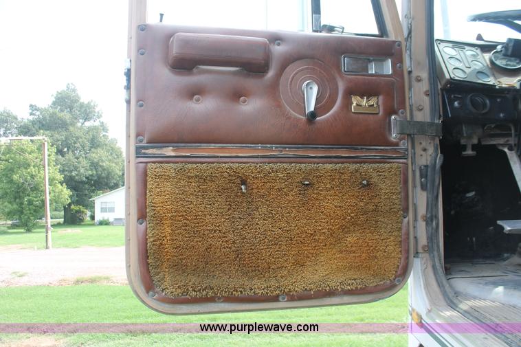 image for item I7895 1982 International Eagle cab over tri axle flatbed truck