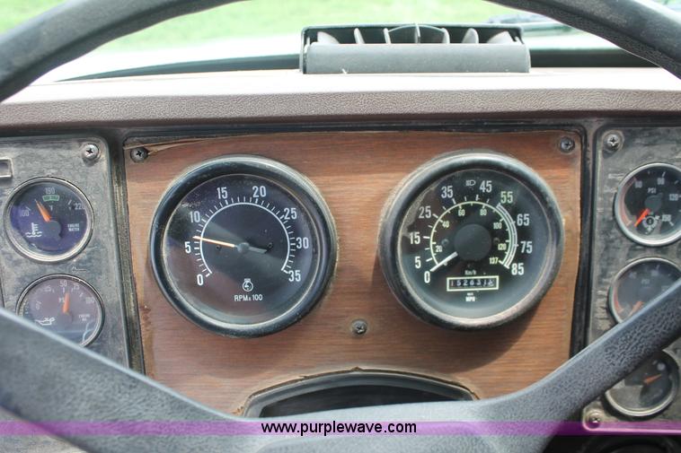 image for item I7895 1982 International Eagle cab over tri axle flatbed truck