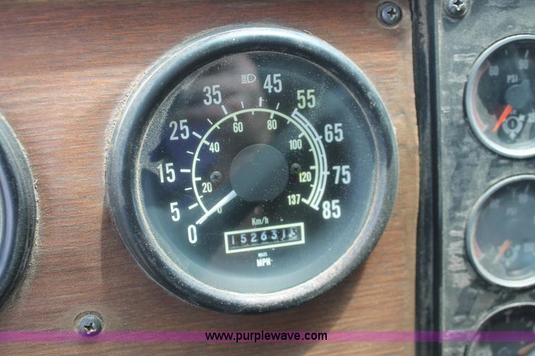 image for item I7895 1982 International Eagle cab over tri axle flatbed truck