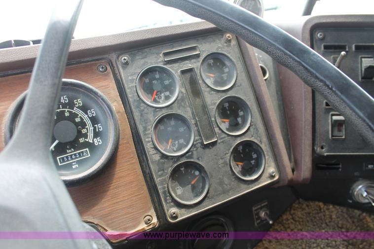 image for item I7895 1982 International Eagle cab over tri axle flatbed truck