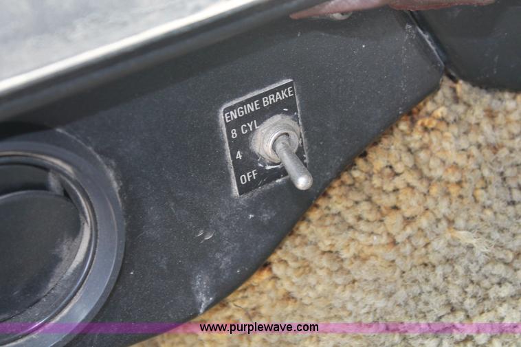 image for item I7895 1982 International Eagle cab over tri axle flatbed truck