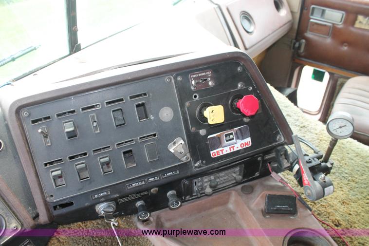 image for item I7895 1982 International Eagle cab over tri axle flatbed truck