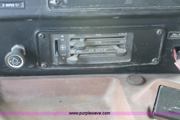 image for item I7895 1982 International Eagle cab over tri axle flatbed truck