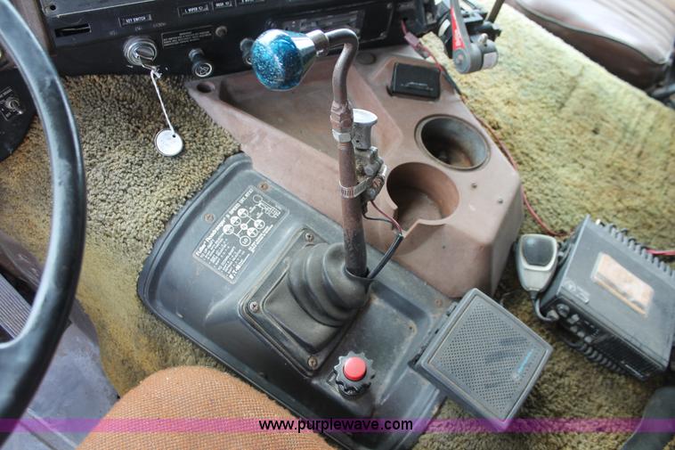 image for item I7895 1982 International Eagle cab over tri axle flatbed truck