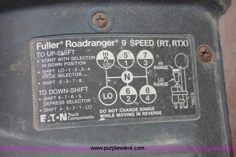 image for item I7895 1982 International Eagle cab over tri axle flatbed truck