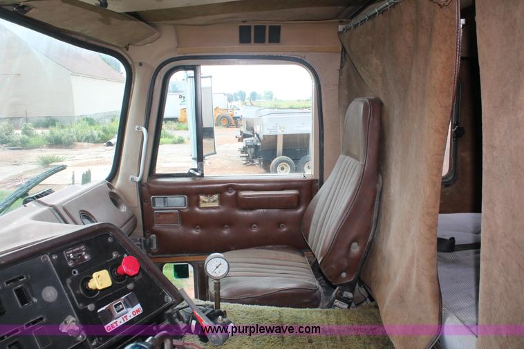 image for item I7895 1982 International Eagle cab over tri axle flatbed truck