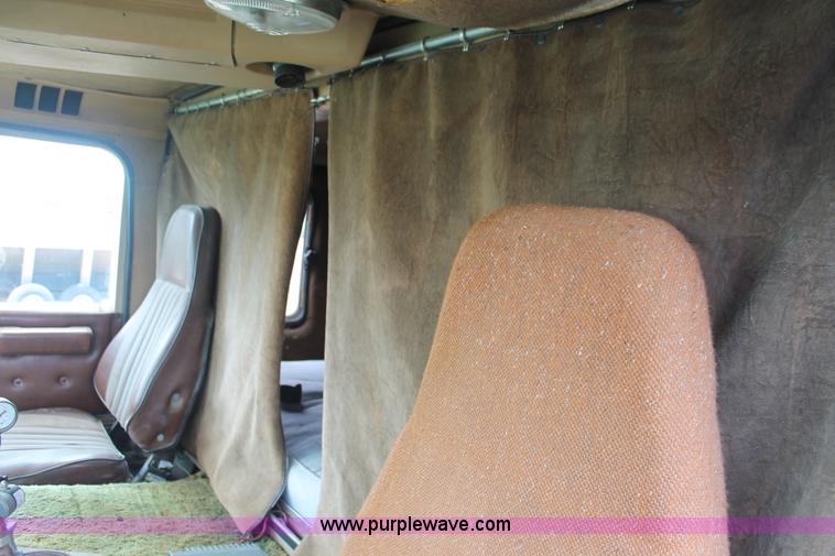 image for item I7895 1982 International Eagle cab over tri axle flatbed truck