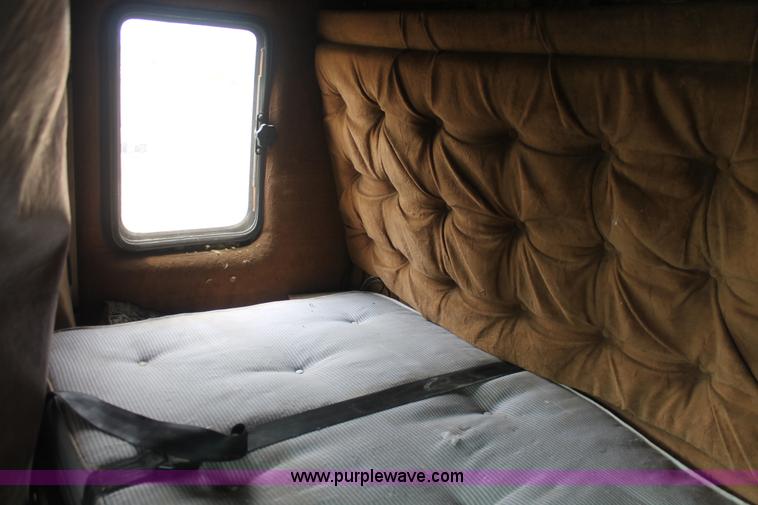 image for item I7895 1982 International Eagle cab over tri axle flatbed truck