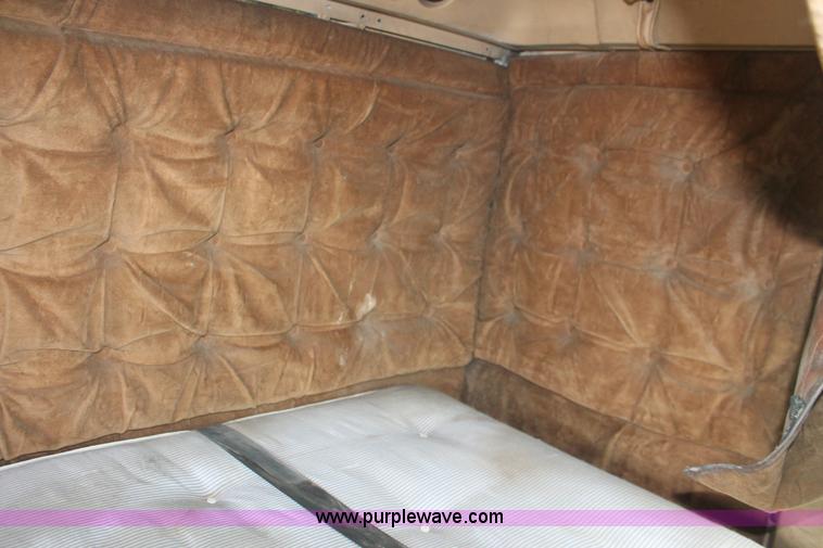 image for item I7895 1982 International Eagle cab over tri axle flatbed truck