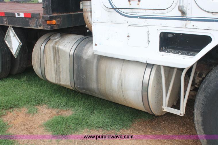 image for item I7895 1982 International Eagle cab over tri axle flatbed truck