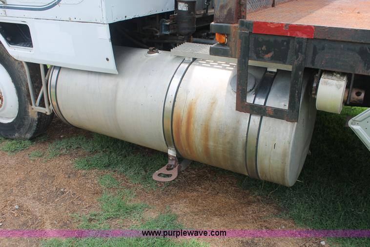 image for item I7895 1982 International Eagle cab over tri axle flatbed truck