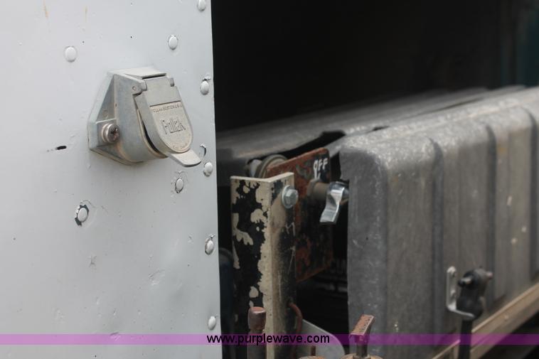 image for item I7895 1982 International Eagle cab over tri axle flatbed truck