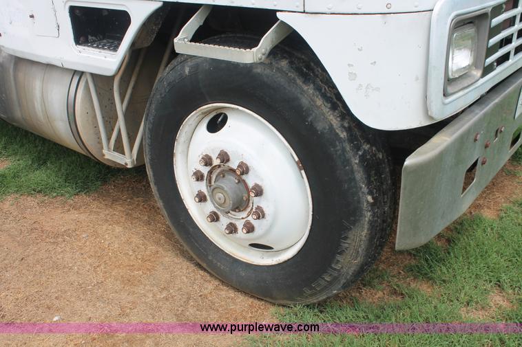 image for item I7895 1982 International Eagle cab over tri axle flatbed truck