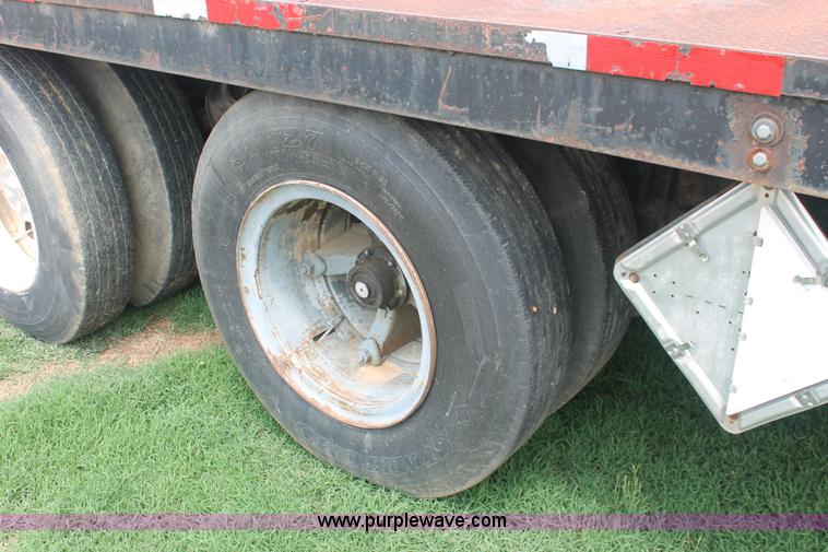 image for item I7895 1982 International Eagle cab over tri axle flatbed truck