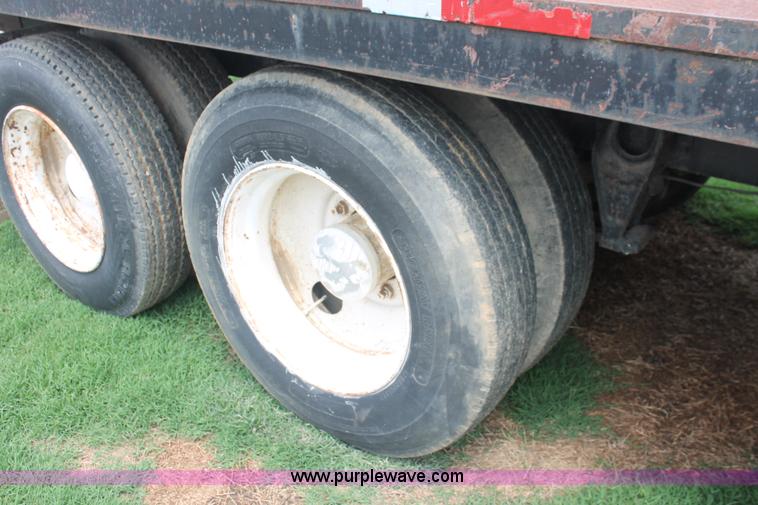 image for item I7895 1982 International Eagle cab over tri axle flatbed truck