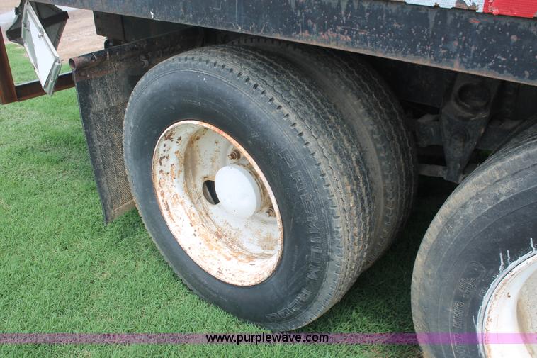 image for item I7895 1982 International Eagle cab over tri axle flatbed truck