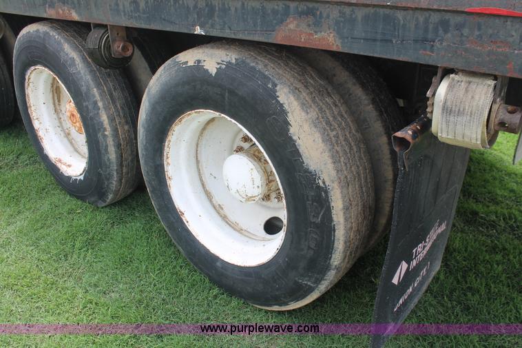 image for item I7895 1982 International Eagle cab over tri axle flatbed truck