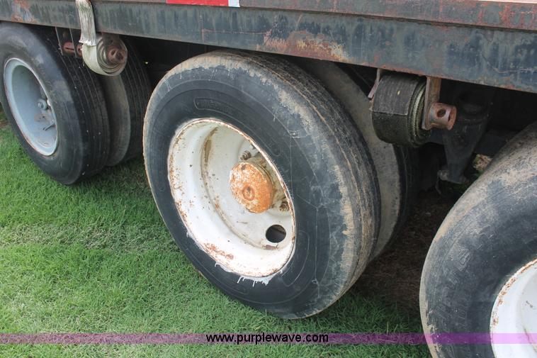 image for item I7895 1982 International Eagle cab over tri axle flatbed truck