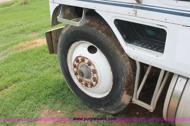 image for item I7895 1982 International Eagle cab over tri axle flatbed truck