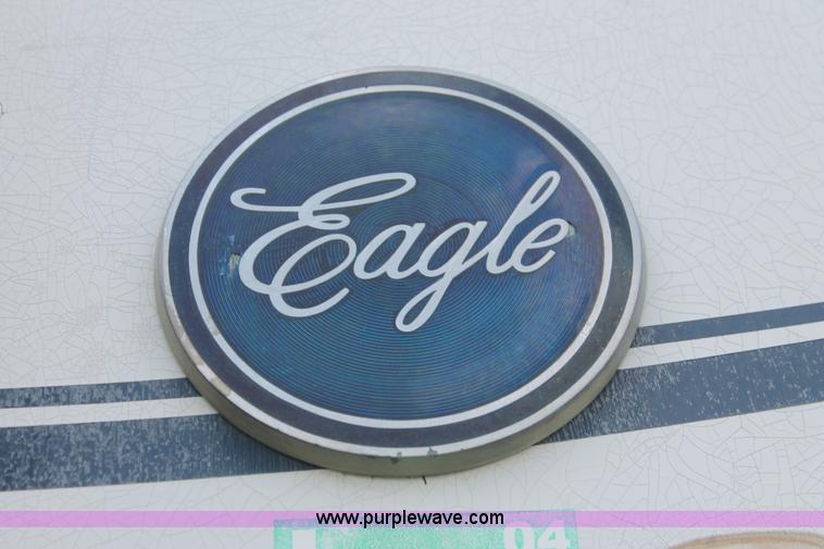 image for item I7895 1982 International Eagle cab over tri axle flatbed truck