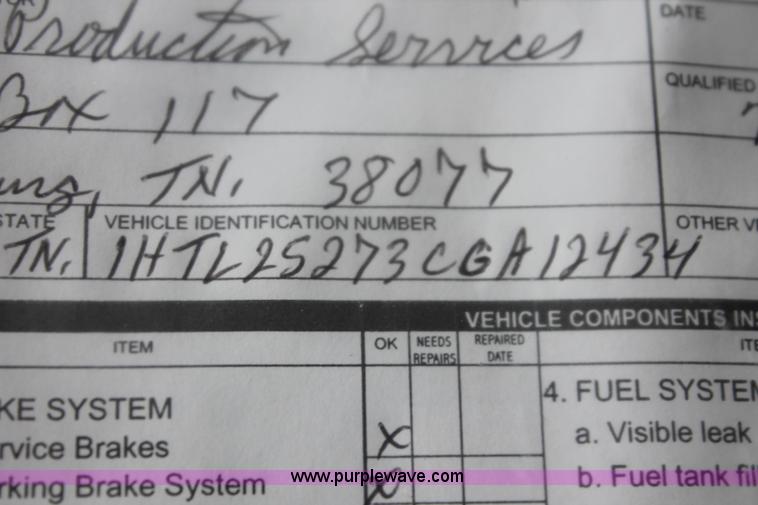 image for item I7895 1982 International Eagle cab over tri axle flatbed truck