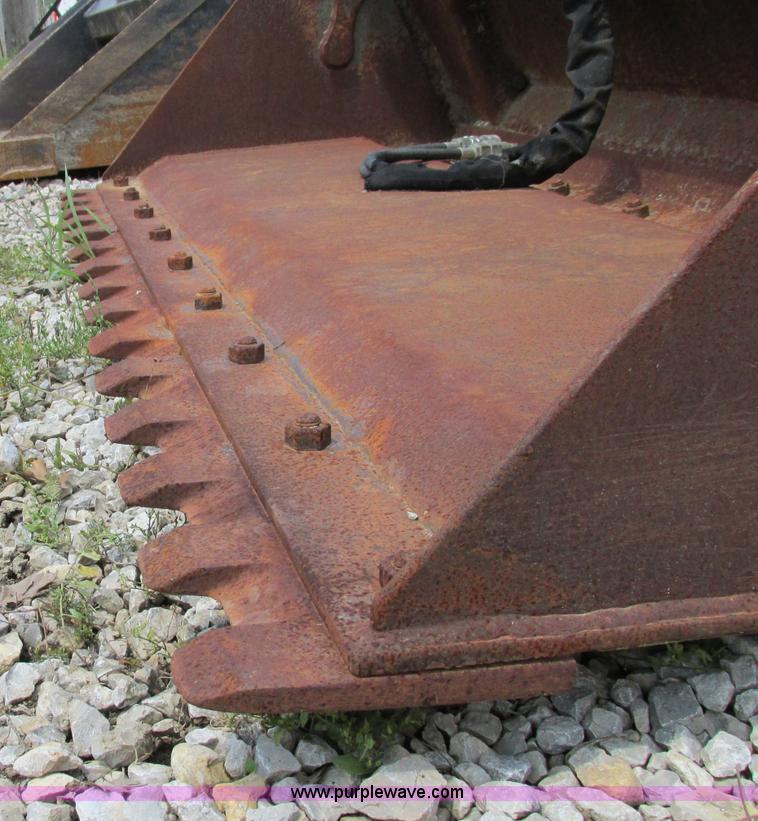 image for item AC9441 Case 72"W combination skid steer bucket