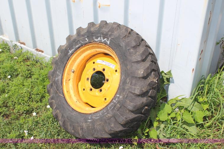 image for item AU9037 10-16.5 skid steer tire and wheel